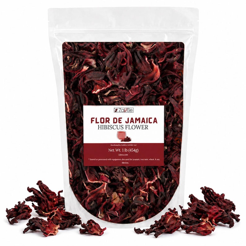 May include: A transparent bag containing dried hibiscus flowers, with some scattered around the base. The label on the bag reads "FLOR DE JAMAICA HIBISCUS FLOWER" and states the net weight as 454g. The flowers are a rich, dark red colour.