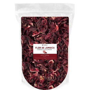 May include: A clear plastic bag filled with dried red hibiscus flowers. The bag has a label that reads "Zol Be Flor de Jamaica Hibiscus Flower Net Wt. 2 lb (900g)"