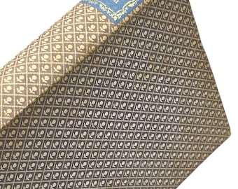 May include: A brown book with a gold and white patterned cover. The title "Pride & Prejudice" is printed in gold on the spine. The author "Jane Austen" is printed in blue on the spine.