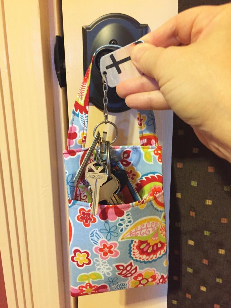 Light Green Leaves or Foliage with Metalic Flowers Pocket Door Knob Pouch with a Hanging Loop Cell Phone Charging Pocket