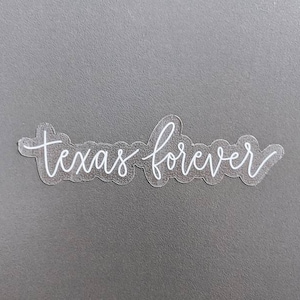 May include: White vinyl sticker with the text "Texas forever" in a cursive font.