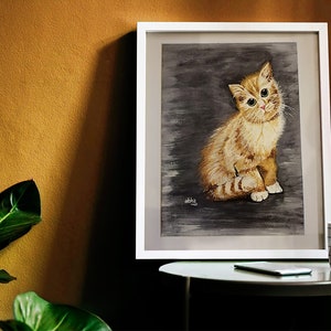 May include: A framed watercolor painting of a ginger kitten sitting on a gray background. The kitten has green eyes and is looking directly at the viewer.