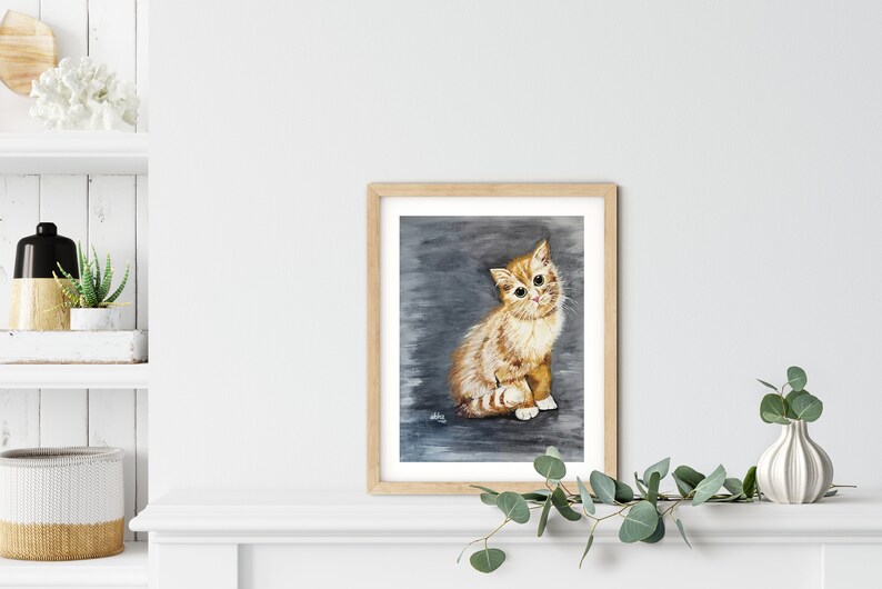 May include: A watercolor painting of a ginger kitten sitting on a gray background. The kitten has big green eyes and is looking directly at the viewer.