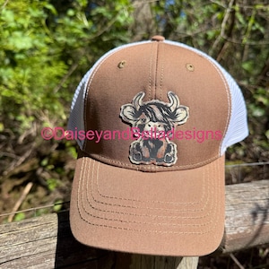 womens Caramel/white,  ponytail hat. with engraved/lasered  highland cow/cowhide print , patch.  With FREE shipping