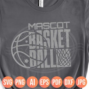 May include: Gray t-shirt with a basketball-themed design. The design features the words "MASCOT BASKET BALL" in a bold, blocky font, overlaid on a basketball graphic. Below the design are file type icons: SVG, PNG, AI, EPS, PDF, DXF, JPG.