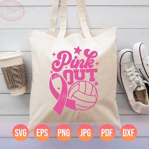 May include: A pink tote bag with the text "Pink Out" and a pink ribbon and volleyball graphic. The bag is made of canvas and has a natural color.