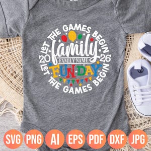May include: A gray baby onesie with a circular design that reads "Let the Games Begin" around the edge. The word "Family" is in the center, with "Fun Day" below it. Colorful balloons and a banner are included in the design. The bottom of the onesie has file type icons.