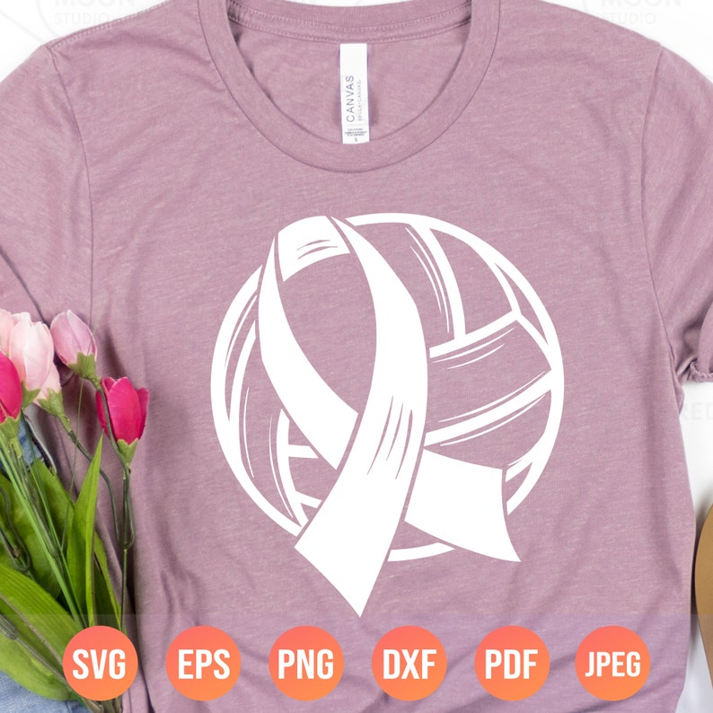 May include: A white silhouette of a volleyball with a white ribbon wrapped around it. The ribbon is tied in a bow at the top of the volleyball. The image is on a pink t-shirt.
