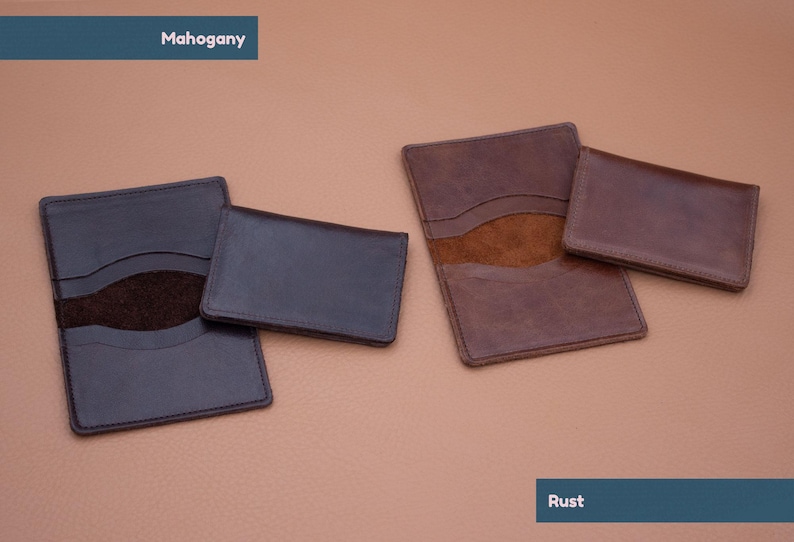 May include: Two leather card holders, one in mahogany and one in rust. Both have a suede interior and a single pocket.