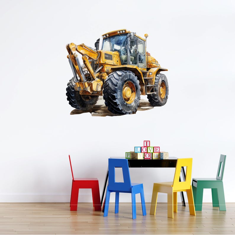 May include: Watercolor illustration of a yellow construction vehicle with large black tires. The image is a wall decal, with a black table and colorful chairs below. The word blocks spell out "I LOVE YOU".