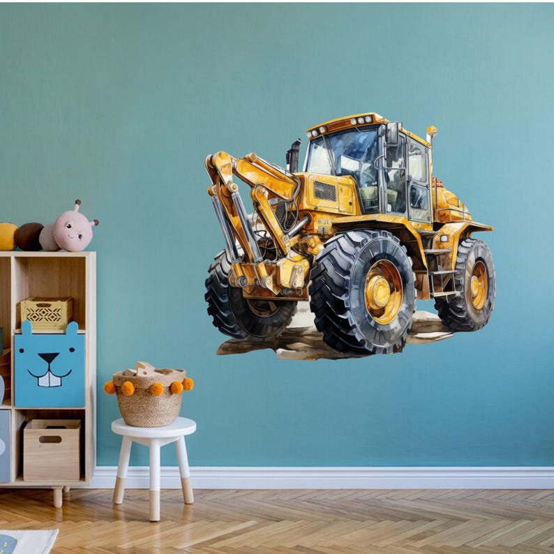 May include: Watercolor illustration of a yellow construction vehicle with large black tires. The heavy equipment is depicted on a light brown surface against a teal wall. The vehicle has a detailed design and is suitable for a child's room.