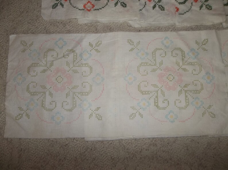 White with orange 16 stitched Vintage Cross-stitch quilt Squares 12 un-stitched green.