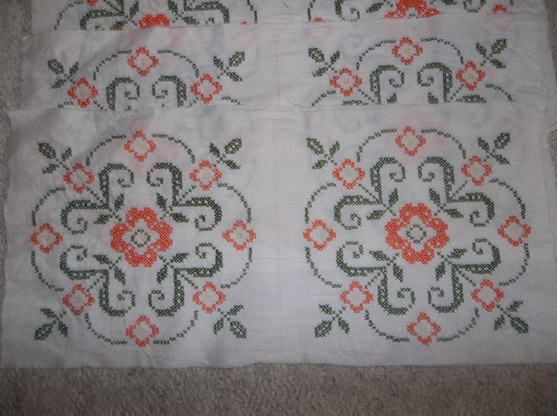 White with orange 16 stitched Vintage Cross-stitch quilt Squares 12 un-stitched green.