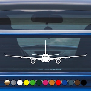 May include: White airplane silhouette decal for a car window. The decal is a simple outline of a plane with a front view of the cockpit.