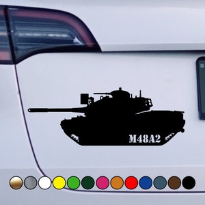 May include: Black silhouette of a military tank with the text "M48A2" on the side. The tank is on a white background.