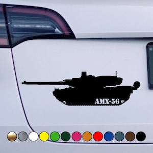May include: A black silhouette of a tank with the text "AMX-56" on the side. The tank is on a white background.