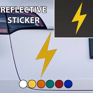 May include: A white car with a yellow lightning bolt reflective sticker on the back. The sticker says "REFLECTIVE STICKER" above the lightning bolt. There are six colour swatches below the sticker.