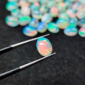 Dimensioni calibrate 10x8 MM Bellissimo lotto di pietre preziose cabochon opale etiope naturale, pietra preziosa cabochon, lotto misto, lotto opale.