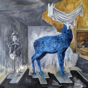 May include: A blue deer sculpture with a white cloth draped over its antlers stands on a wooden platform in a room with a person in the background. The room has a gray and white color scheme.