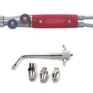 May include: A red and silver torch with a Gloor logo and three interchangeable tips. The torch has two knobs for adjusting the flame.