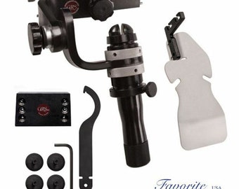 May include: A black camera stabilizer with a silver knob and a black handle. The stabilizer is mounted on a black base with a silver knob. The stabilizer is also equipped with a black wrench and four black rubber feet. The stabilizer is labeled "GRS" in red.