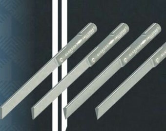 May include: Four silver metal chisels with the text "GLADSON HALL" printed on each. The chisels are arranged in a row, with the handles pointing to the right.