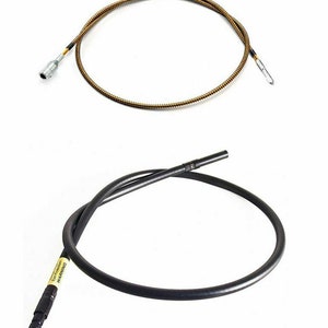 May include: Two motorcycle cables, one with a black outer sheath and the other with a gold outer sheath. Both cables have a metal connector at each end.