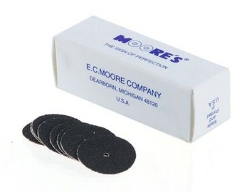 May include: A package of 10 black sanding discs for use with a rotary tool. The package is labeled "Moore's, The Sign of Perfection, E.C. Moore Company, Dearborn, Michigan 48126, U.S.A."