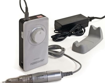 May include: A gray and black electric nail drill with a digital display, a foot pedal, and a stand. The drill is labeled "FOREDOM" and "PORTABLE".
