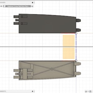 May include: A 3D model of a door mechanism with a cross rail door design. The model is shown in two views, one from the top and one from the side. The door mechanism is made of gray plastic and has a black handle. The model is on a white grid background.