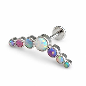 Barra de titanio de 16 g con forma de arco creciente de ópalo de fuego, tragus, hélix, concha y cartílago superior.