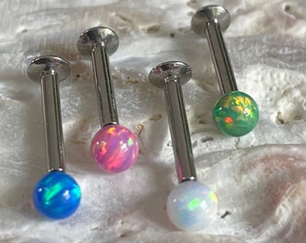 May include: Five silver barbell body jewelry pieces with opal balls in various colors, including blue, pink, green, and white.