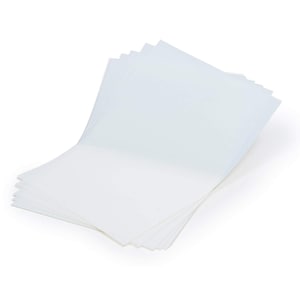 May include: A stack of white paper sheets, folded in half, with the top sheet slightly open.