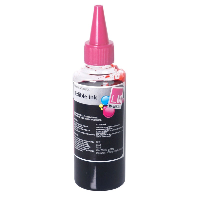 May include: A clear plastic bottle of edible magenta ink with a pink cap. The bottle is labeled "Edible Ink" and "LM Magenta".
