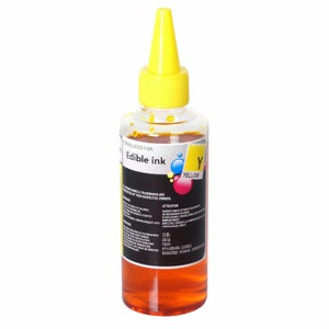 May include: A clear plastic bottle of yellow edible ink with a yellow cap. The label reads "Formulated for: Edible ink" and "Y Yellow".