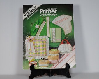 Linda Dennis’ Primer Charted Designs ribband, ribbon to cross stich 70 projects 1981