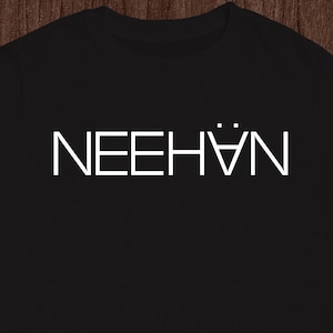 May include: Black t-shirt with the word "NEEHÄN" printed in white on the front.