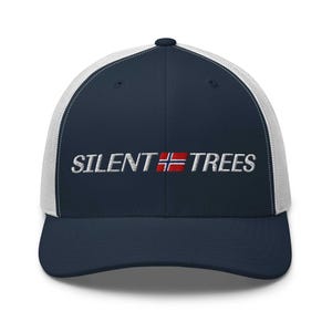 May include: A navy blue and white trucker hat with the embroidered text "SILENT TREES" in white. The Norwegian flag is incorporated into the design. The hat has a curved brim and a mesh back.