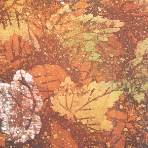 May include: Abstract art print with a brown, orange, and yellow color scheme. The print features a pattern of leaves and splatters of paint.