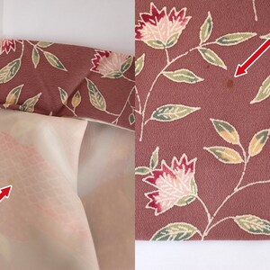 May include: Close-up of a pink fabric with a floral pattern. The fabric has a subtle sheen and is decorated with small, delicate flowers in shades of pink, white, and green. The fabric is slightly creased, giving it a vintage look.