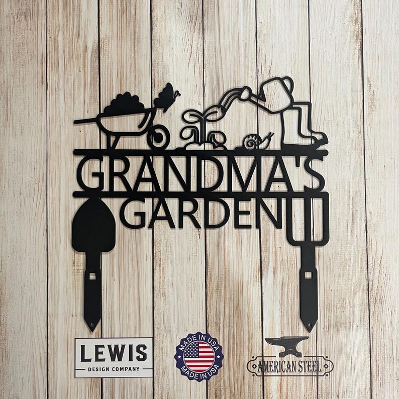 A metal sign with shovels and hand rake. The sign says &ldquo;Grandma&rsquo;s Garden&rdquo;.