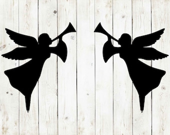 May include: Two black silhouette angels with wings and trumpets, facing opposite directions, against a white wood background.