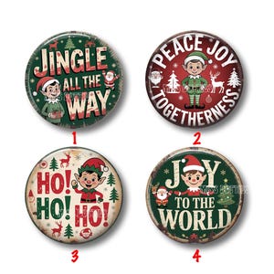 May include: Four round Christmas-themed buttons with festive designs. Each button features an elf, holiday phrases, and seasonal imagery like reindeer and Santa. The color palette includes red, green, and white.