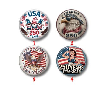 May include: Four round patriotic buttons with red, white, and blue designs. One features gnomes, another an eagle wearing sunglasses, a third an eagle with a flag, and the last a woman saluting. All buttons have "250 YEARS" and "1776-2026" text.
