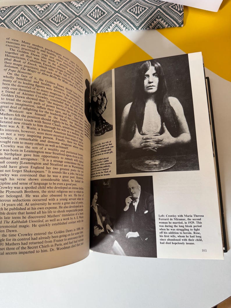 May include: Open book with black and white photographs and text. One photo shows a woman with long hair, another shows two people in a room. The text discusses historical figures and events.