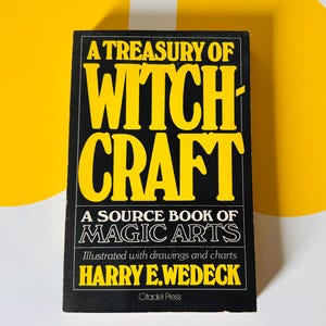May include: A black book titled "A Treasury of Witchcraft" with yellow lettering. The book is a source book of magic arts, illustrated with drawings and charts. The author's name is Harry E. Wedeck.