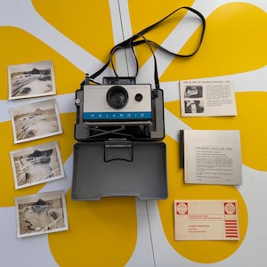 Appareil photo Polaroid 125 terrestre automatique vintage