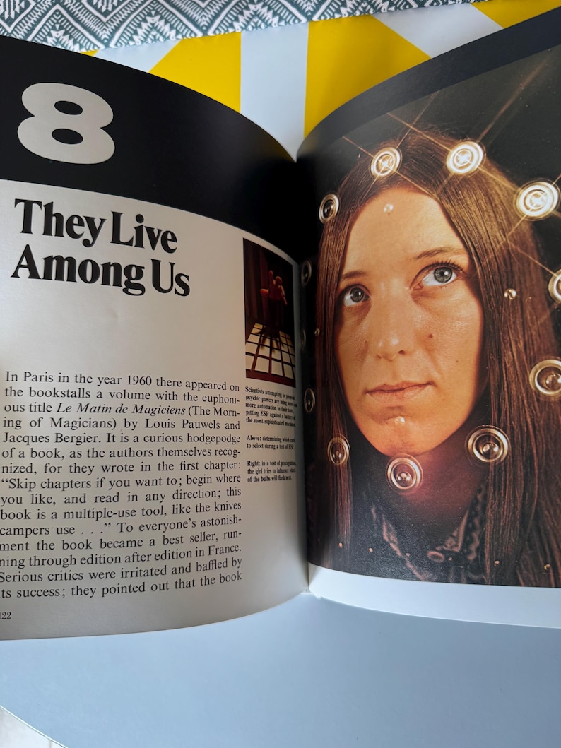 May include: Open book page with the title "They Live Among Us" and a photo of a woman with lights around her head. The number "8" is at the top left. Text describes a book about the morning of magicians.