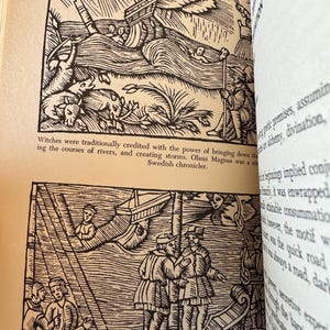 May include: Two black and white illustrations from a book. The top image shows a ship in a storm with figures and animals. The text "MAGIC WINDS" is at the top. The bottom image depicts figures on a boat. Text is visible at the bottom.