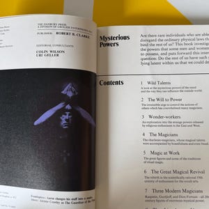 May include: Open book with the title "Mysterious Powers" and a table of contents. The left page features a black and white image of a person with their hands over their eyes. The book explores the potential of latent human abilities.